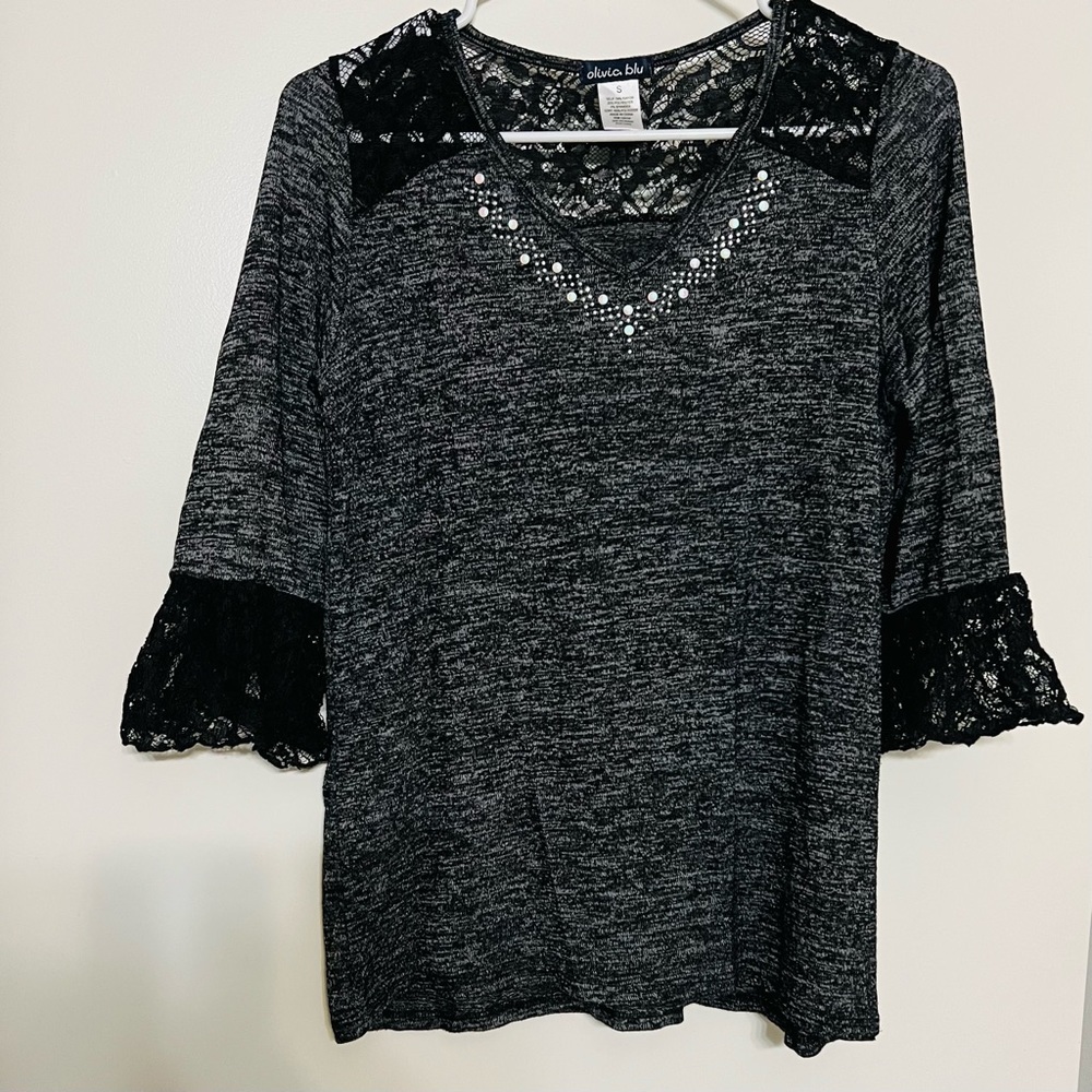 Grayish top with netted cloth at neck and sleeves